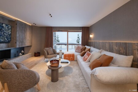 Photographie immobilière à Courchevel : salon d'un appartement dans le chalet le Manej